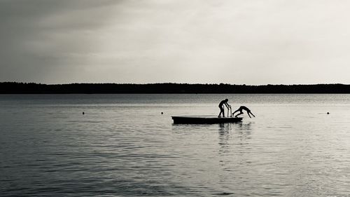 Fisherman fishing in lake