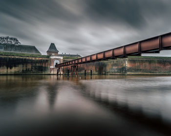 Bridge over water against sky