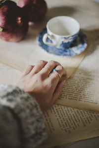 Close up of woman s hand on the table