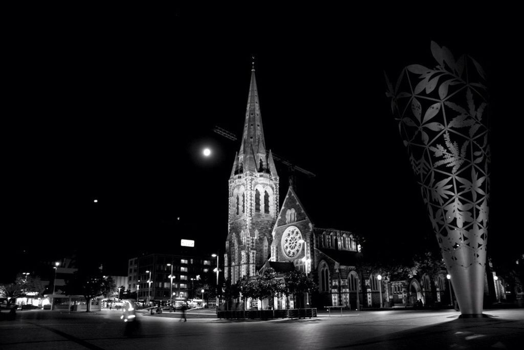 night, illuminated, architecture, building exterior, built structure, religion, clear sky, incidental people, travel destinations, place of worship, transportation, city, famous place, travel, low angle view, sky, spirituality, street, outdoors, street light