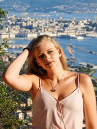 Portrait of young woman standing outdoors