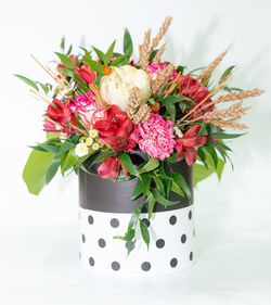 Close-up of flower vase against white background