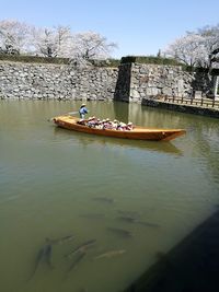 People in boat on river