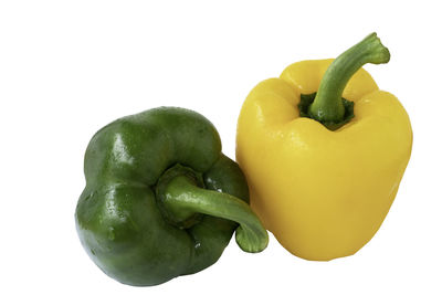 Close-up of bell peppers against white background