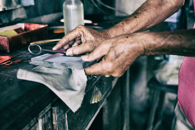 Close-up of hands holding tools