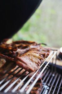 Close-up of meat on barbecue grill