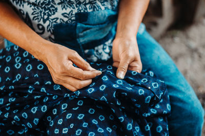 High angle view of people on hands