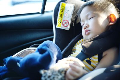 Cute baby girl in car