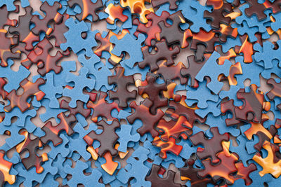 High angle view of multi colored art on textured surface