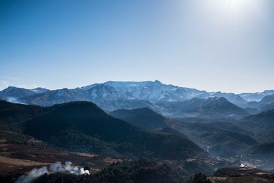 View of mountain range against blue sky