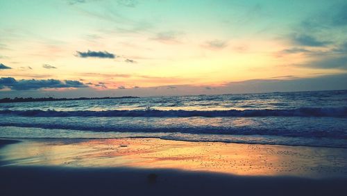 Scenic view of sea against sky at sunset