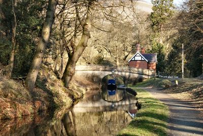 A view of  a barge travelling under the bridge at llangollen canal in wales. uk