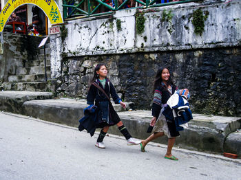 Women standing on walkway