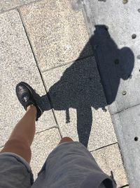 Low section of people standing on street
