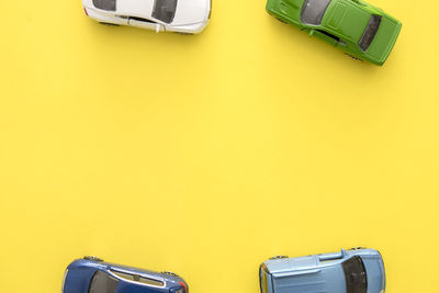 High angle view of toy car on yellow table