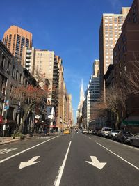 Road in city against clear sky