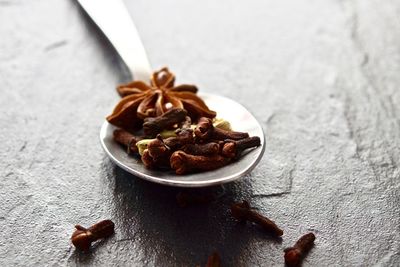 Close-up of spices in spoon on table