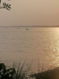 Scenic view of sea against sky at sunset