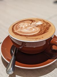 Close-up of cappuccino on table