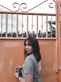 Portrait of young woman looking at camera