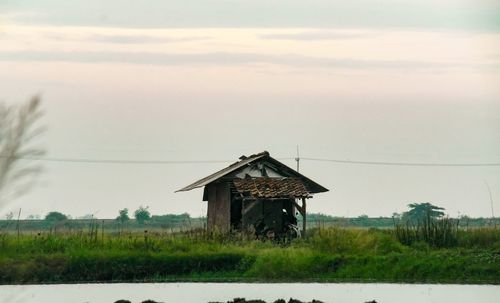 House on field against sky