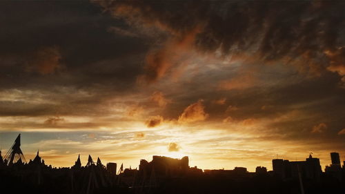 Silhouette of city at sunset