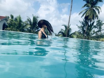 Portrait of woman swimming in pool