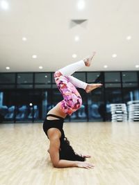 Full length of woman dancing in studio