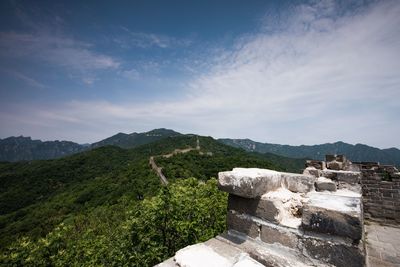 Scenic view of mountain against cloudy sky