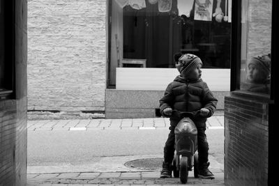 Statue of man sitting outdoors