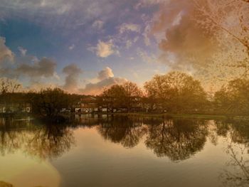 Scenic view of lake against sky during sunset