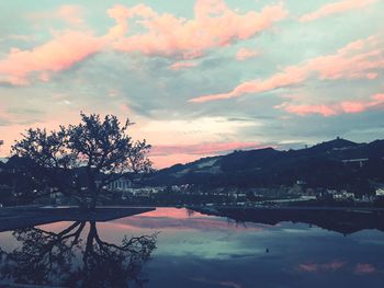 Scenic view of lake against sky during sunset