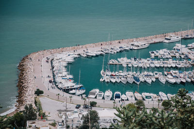 High angle view of sea by buildings in city