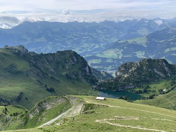 Scenic view of landscape and mountains against sky