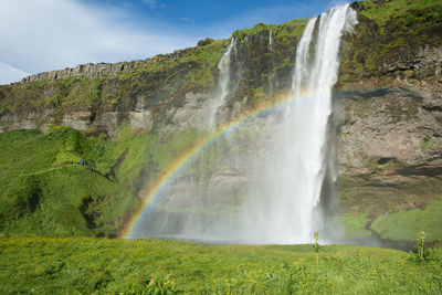 Seljalandsfoss waterfall with a rainbow, iceland