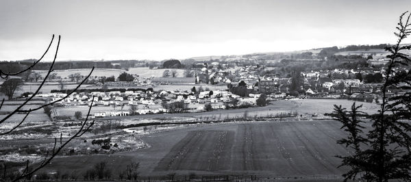 High angle view of road by buildings against sky