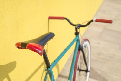 Bicycle parked against wall