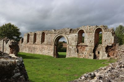 Old ruin building against cloudy sky