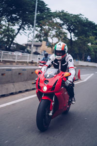 Man riding motorcycle on road