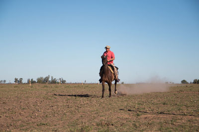 Senior adult man horseback riding