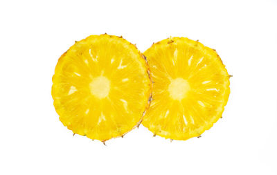 Directly above shot of lemon slice against white background
