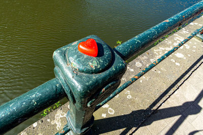 High angle view of metal railing on river