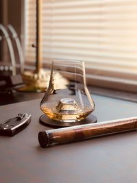 Close-up of whisky glass on table