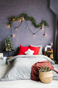 Stylish cozy christmas bedroom with a large bed and decor
