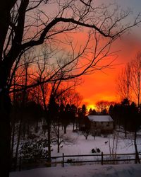 Scenic view of snow covered landscape at sunset