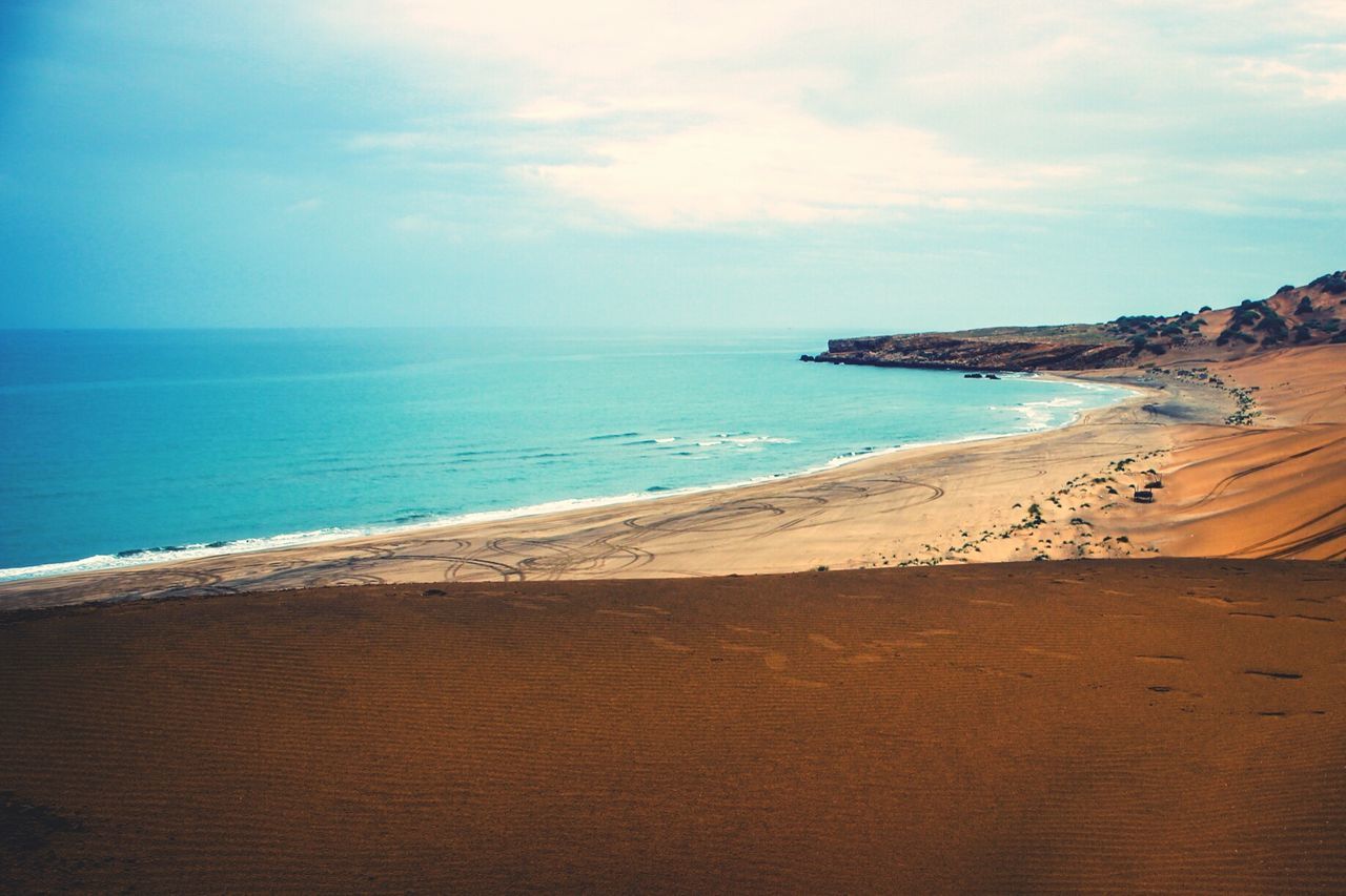 sea, horizon over water, beach, water, sky, tranquil scene, scenics, tranquility, shore, beauty in nature, sand, nature, blue, idyllic, cloud, cloud - sky, coastline, outdoors, remote, calm