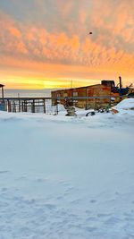 Scenic view of snow during sunset