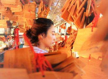 Woman looking away at market stall