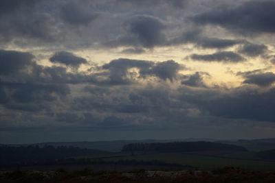 Scenic view of dramatic sky over land