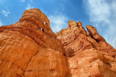 Low angle view of rock formation against sky